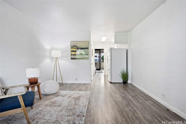 sitting room featuring hardwood / wood-style flooring