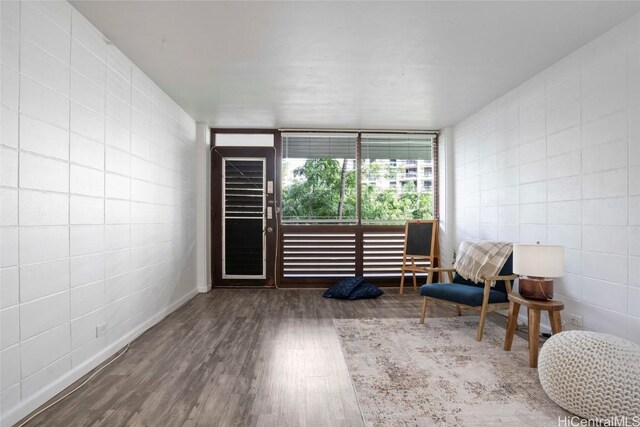 sitting room featuring wood-type flooring