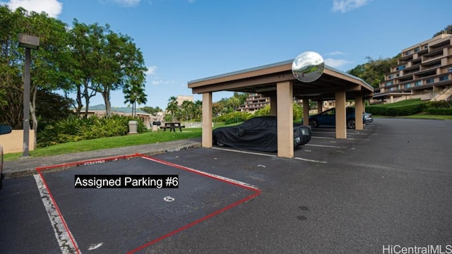 view of partially covered parking lot