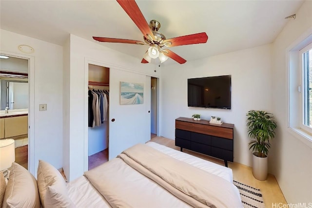 bedroom with a ceiling fan and a closet