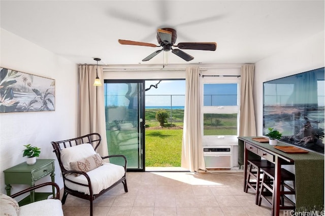 doorway to outside featuring light tile patterned floors and ceiling fan