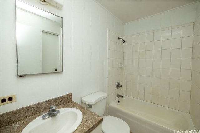 full bathroom with vanity, tiled shower / bath, and toilet