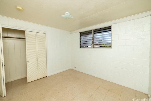 unfurnished bedroom featuring a closet