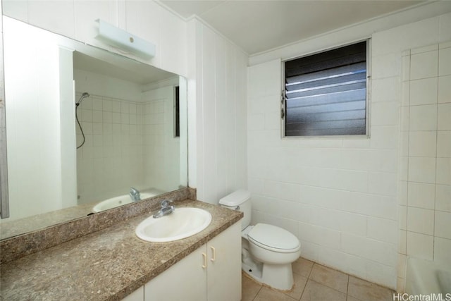 bathroom featuring tile patterned flooring, vanity, and toilet