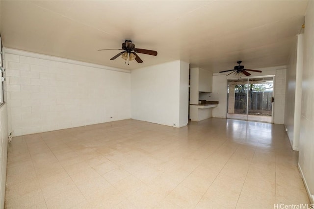 interior space with ceiling fan