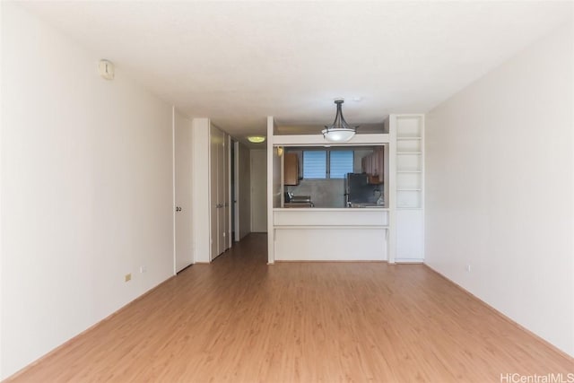 unfurnished living room with light wood-style floors