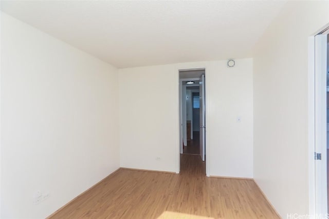 unfurnished room featuring light wood-style flooring