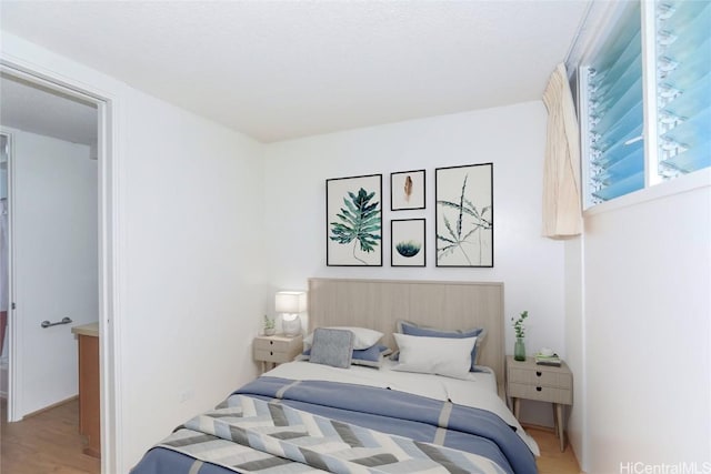 bedroom featuring wood finished floors