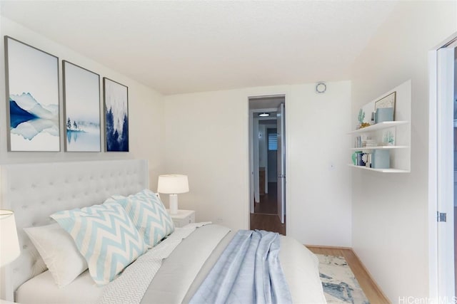 bedroom featuring wood finished floors