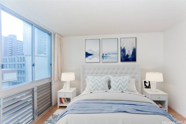 bedroom with light wood finished floors