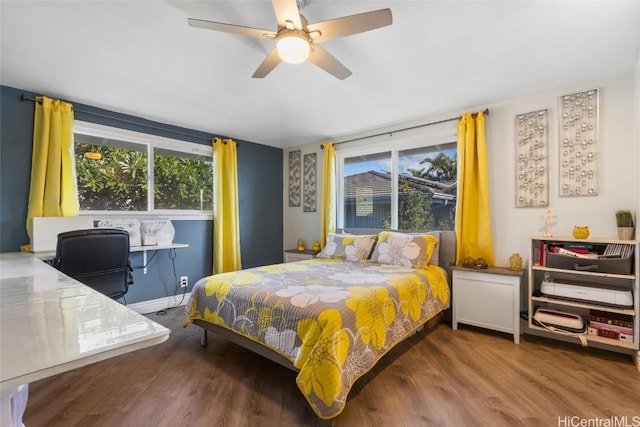 bedroom with hardwood / wood-style floors and ceiling fan