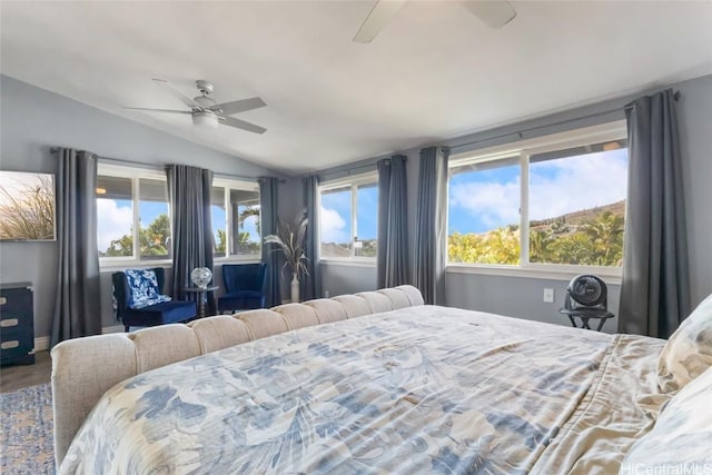 bedroom featuring ceiling fan and lofted ceiling