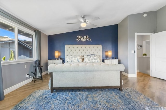 bedroom featuring hardwood / wood-style flooring and ceiling fan