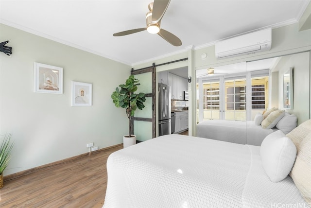 bedroom featuring crown molding, ceiling fan, a barn door, a wall mounted AC, and wood-type flooring