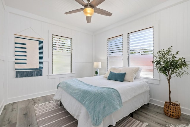 bedroom with hardwood / wood-style flooring and ceiling fan