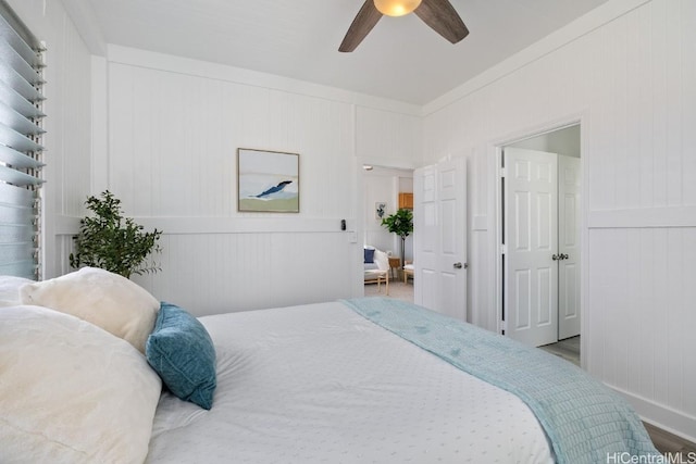 bedroom with ceiling fan and hardwood / wood-style floors