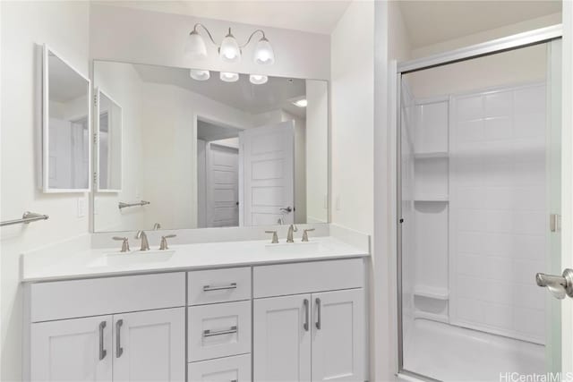 bathroom featuring vanity and a shower