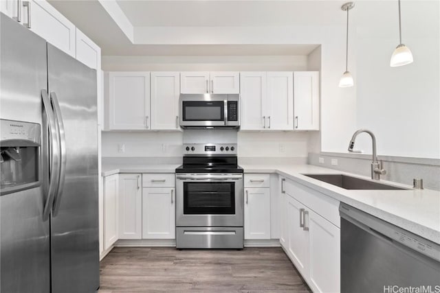 kitchen featuring white cabinetry, sink, and appliances with stainless steel finishes