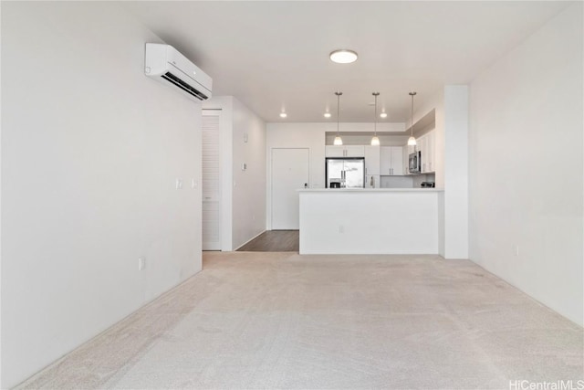 unfurnished living room with light colored carpet and a wall mounted air conditioner