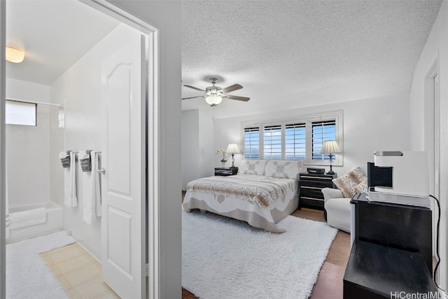 bedroom with a textured ceiling and ceiling fan