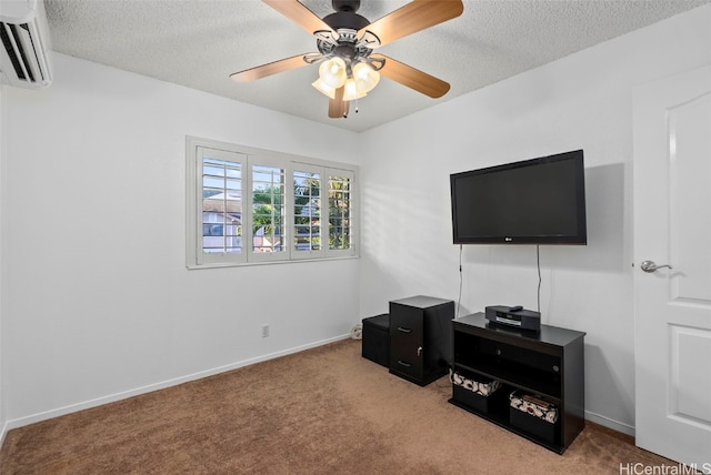 interior space featuring an AC wall unit, light carpet, ceiling fan, and a textured ceiling