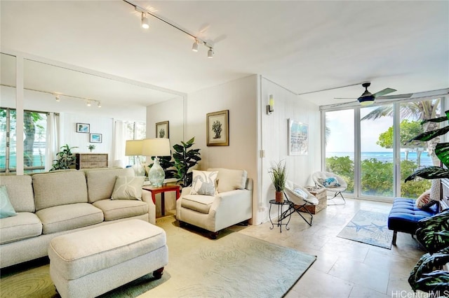 living room featuring a ceiling fan and track lighting