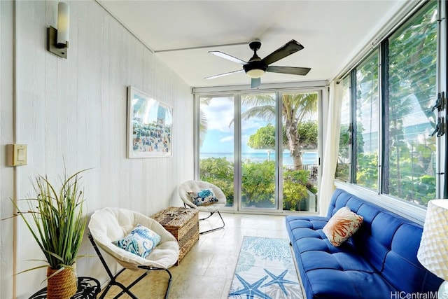 sunroom featuring ceiling fan