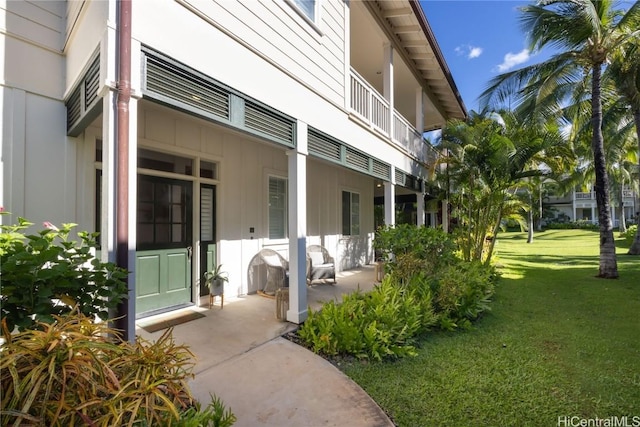 entrance to property with a yard