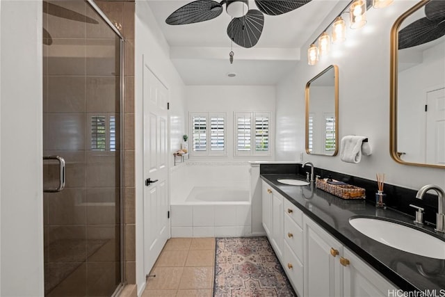 bathroom with ceiling fan, tile patterned floors, plus walk in shower, and vanity