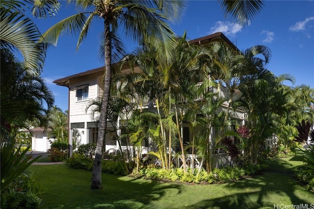 view of home's exterior featuring a lawn