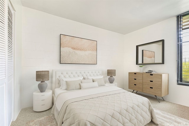 bedroom with light colored carpet