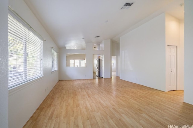 unfurnished room with light wood-type flooring