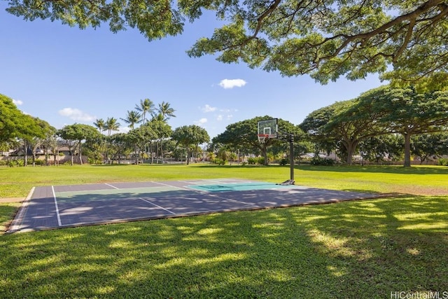 view of sport court featuring a yard