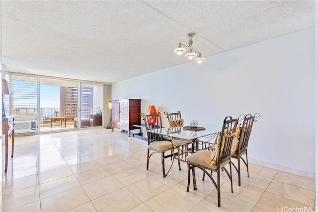 tiled dining area with a textured ceiling, floor to ceiling windows, and a notable chandelier