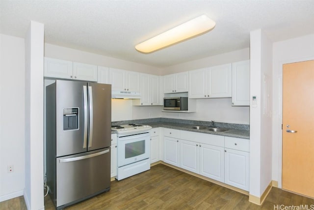 kitchen with white cabinets, sink, a textured ceiling, dark hardwood / wood-style flooring, and stainless steel appliances