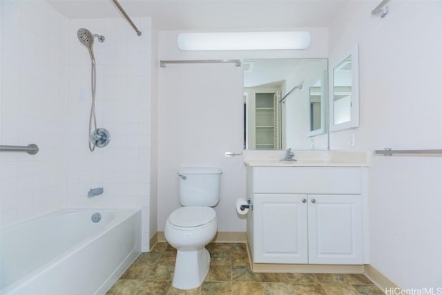 full bathroom with tiled shower / bath combo, toilet, and vanity