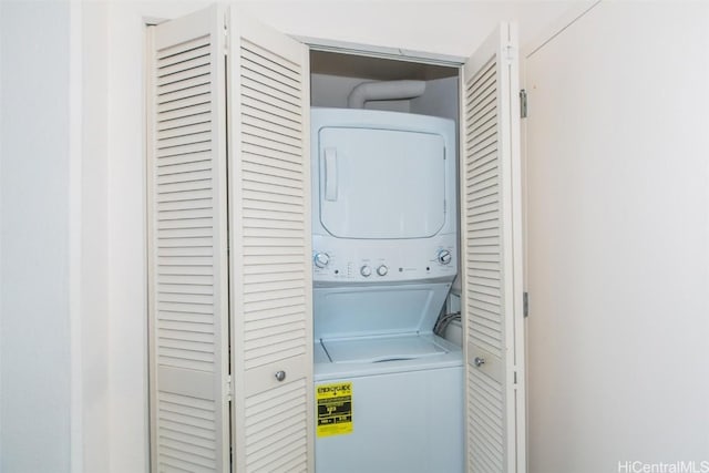 laundry area with stacked washer / drying machine