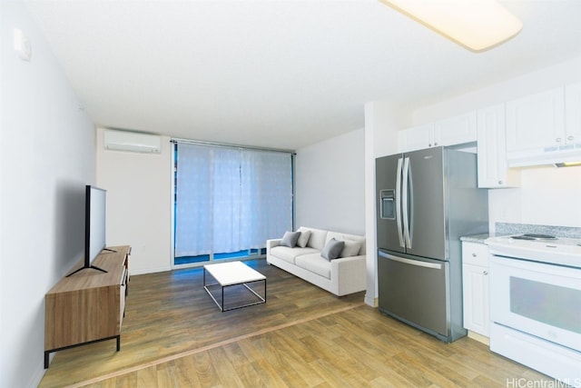 living room featuring a wall mounted AC and hardwood / wood-style flooring