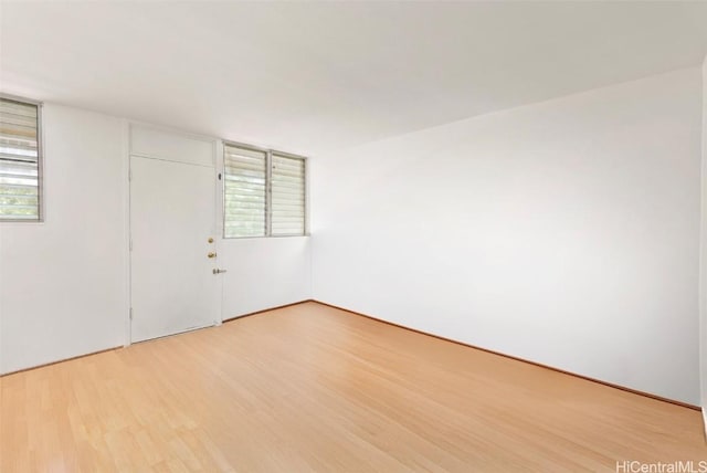 unfurnished room with light hardwood / wood-style floors