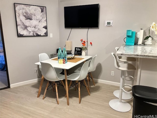 dining space featuring light hardwood / wood-style flooring