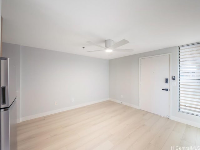 unfurnished room featuring ceiling fan and light hardwood / wood-style flooring