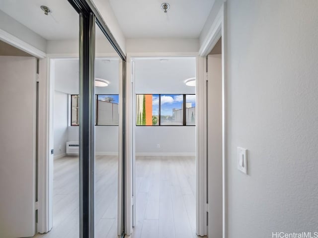 hallway featuring light hardwood / wood-style flooring