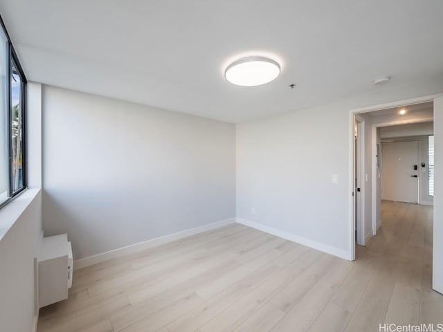 empty room with light hardwood / wood-style floors