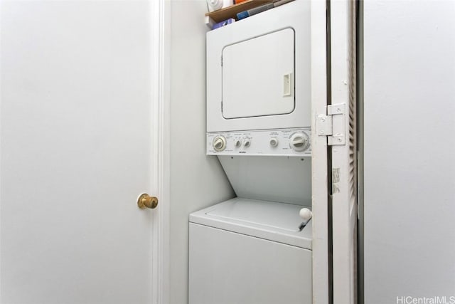 laundry room with stacked washer and clothes dryer