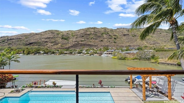 view of pool featuring a water and mountain view