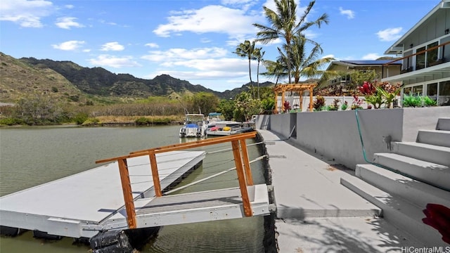 dock area with a water and mountain view