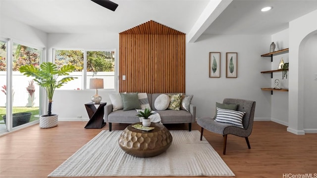 living room with hardwood / wood-style floors and built in features