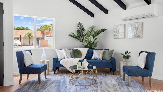 living area with a healthy amount of sunlight, wood-type flooring, and an AC wall unit