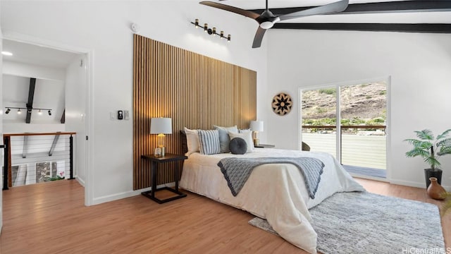 bedroom featuring beam ceiling, ceiling fan, high vaulted ceiling, light hardwood / wood-style floors, and access to outside