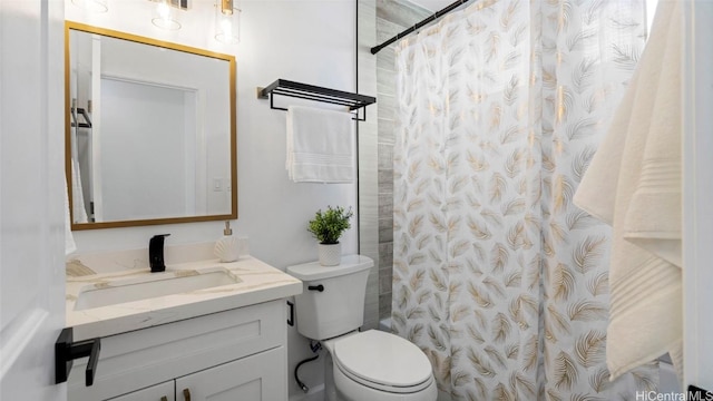 bathroom featuring a shower with shower curtain, vanity, and toilet